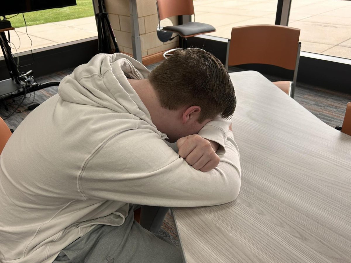 Student sleeping in the library.  